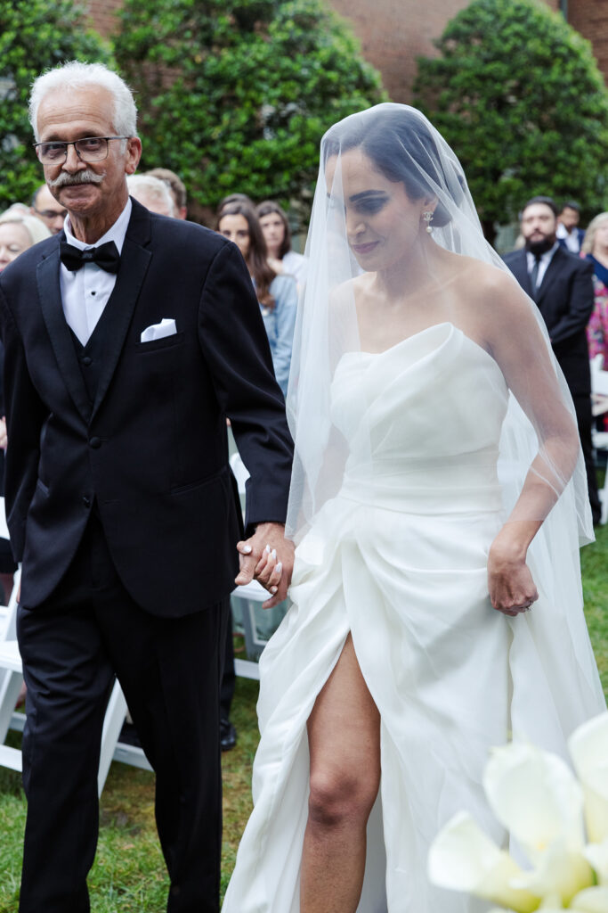 Bride walking down the aisle with father