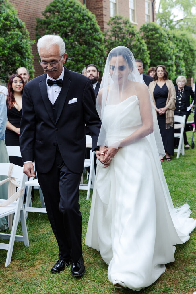 Bride walking down the aisle with father