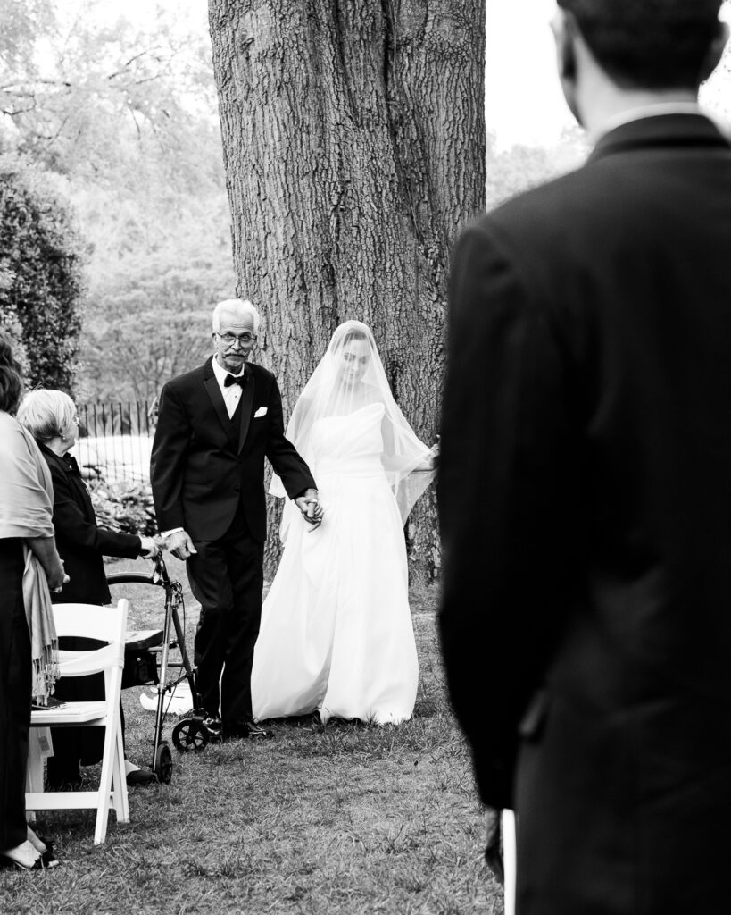 Father leading bride down the aisle