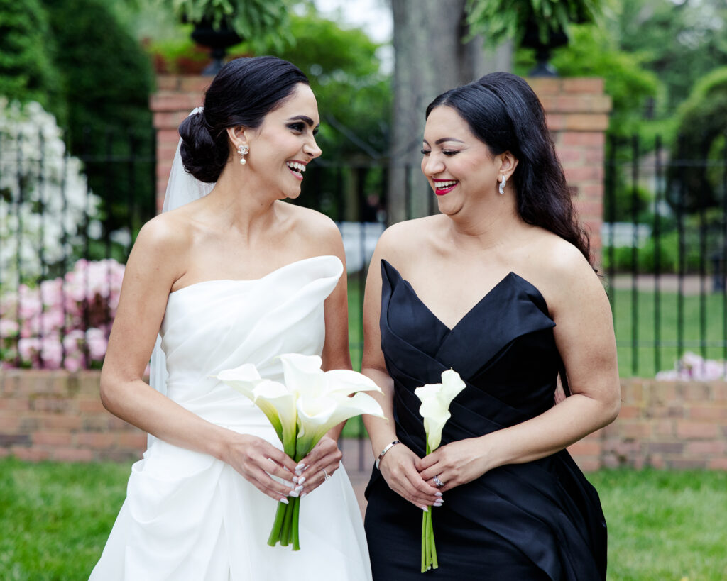 Bride and her bridesmaid in a garden